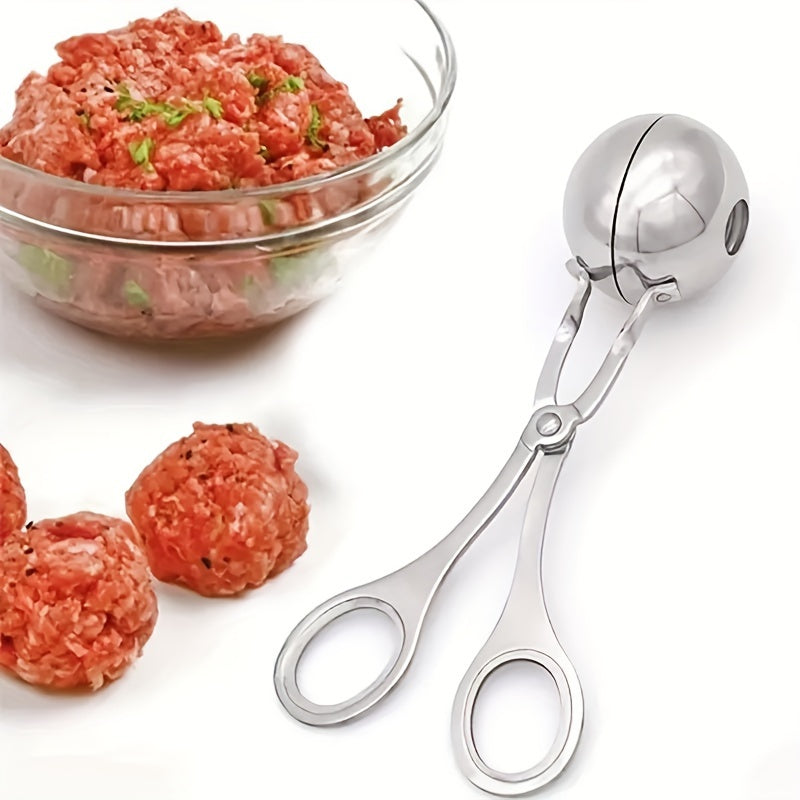 Stainless steel meatball press with non-slip handle.
