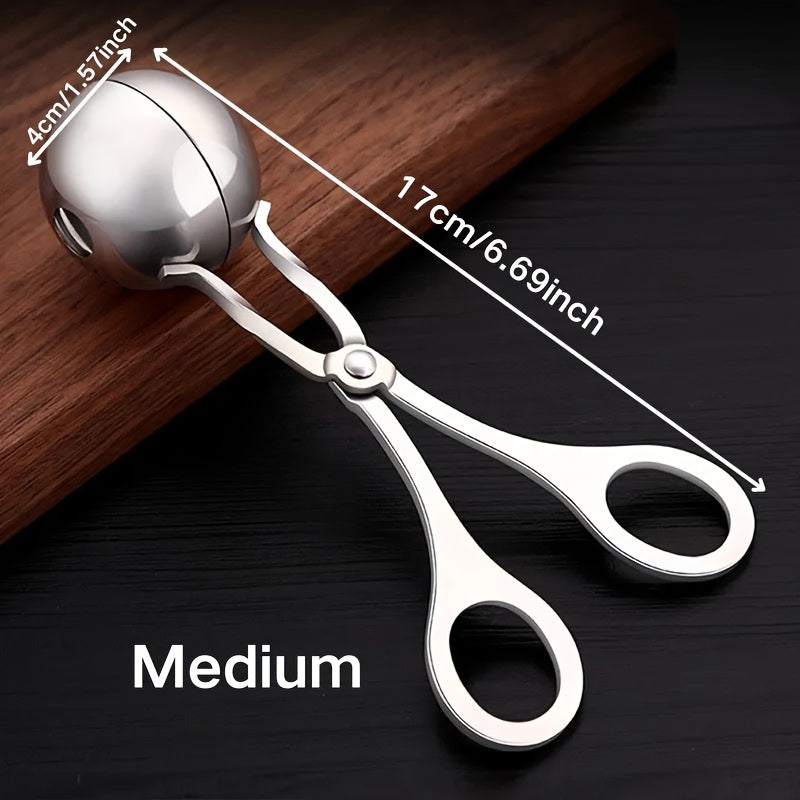 Stainless steel meatball press with non-slip handle.
