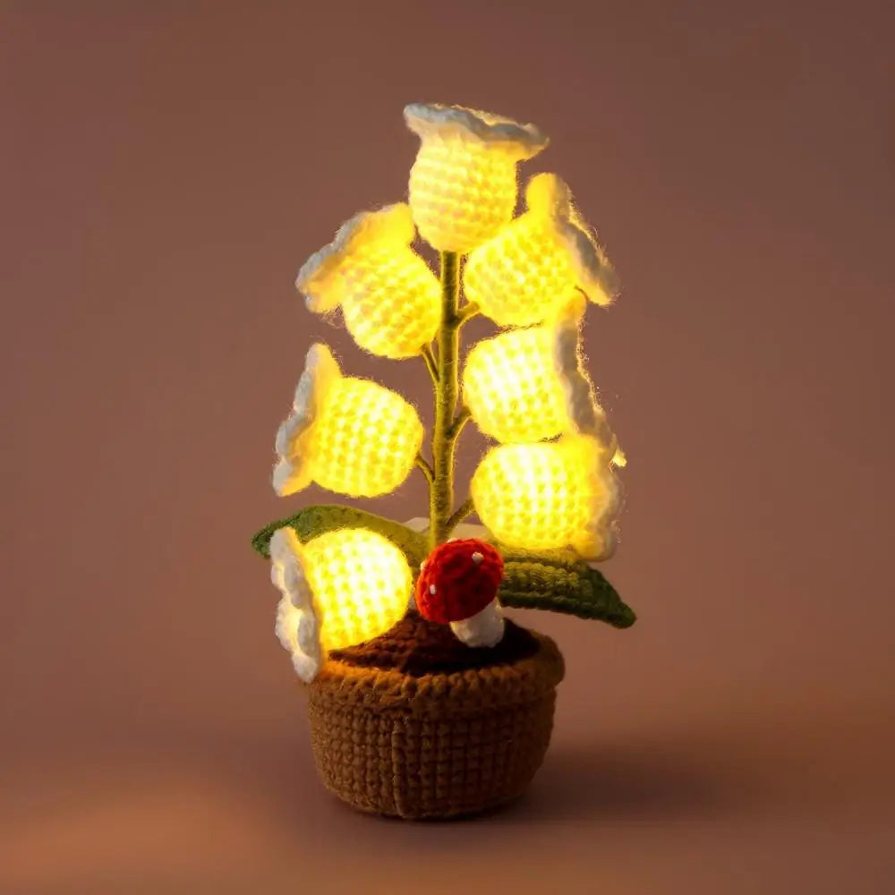 Knitted lily of the valley with LED light.
