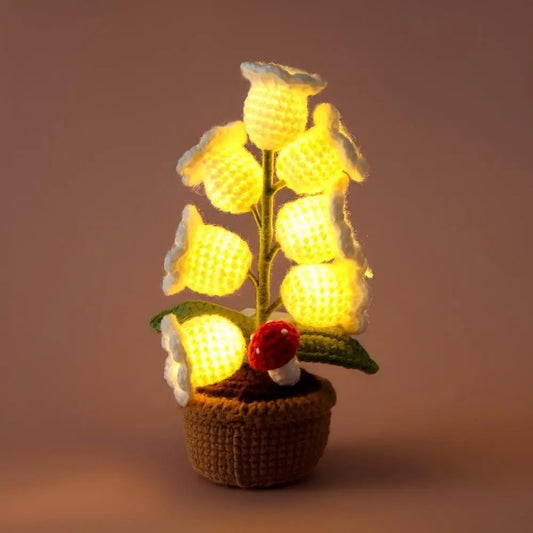Knitted lily of the valley with LED light.