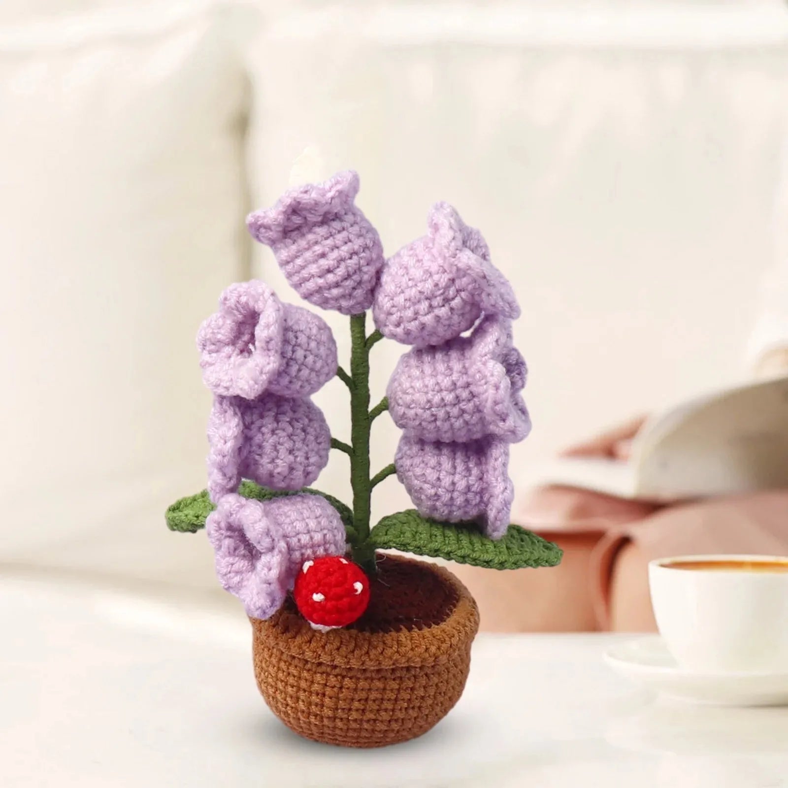 Knitted lily of the valley with LED light.