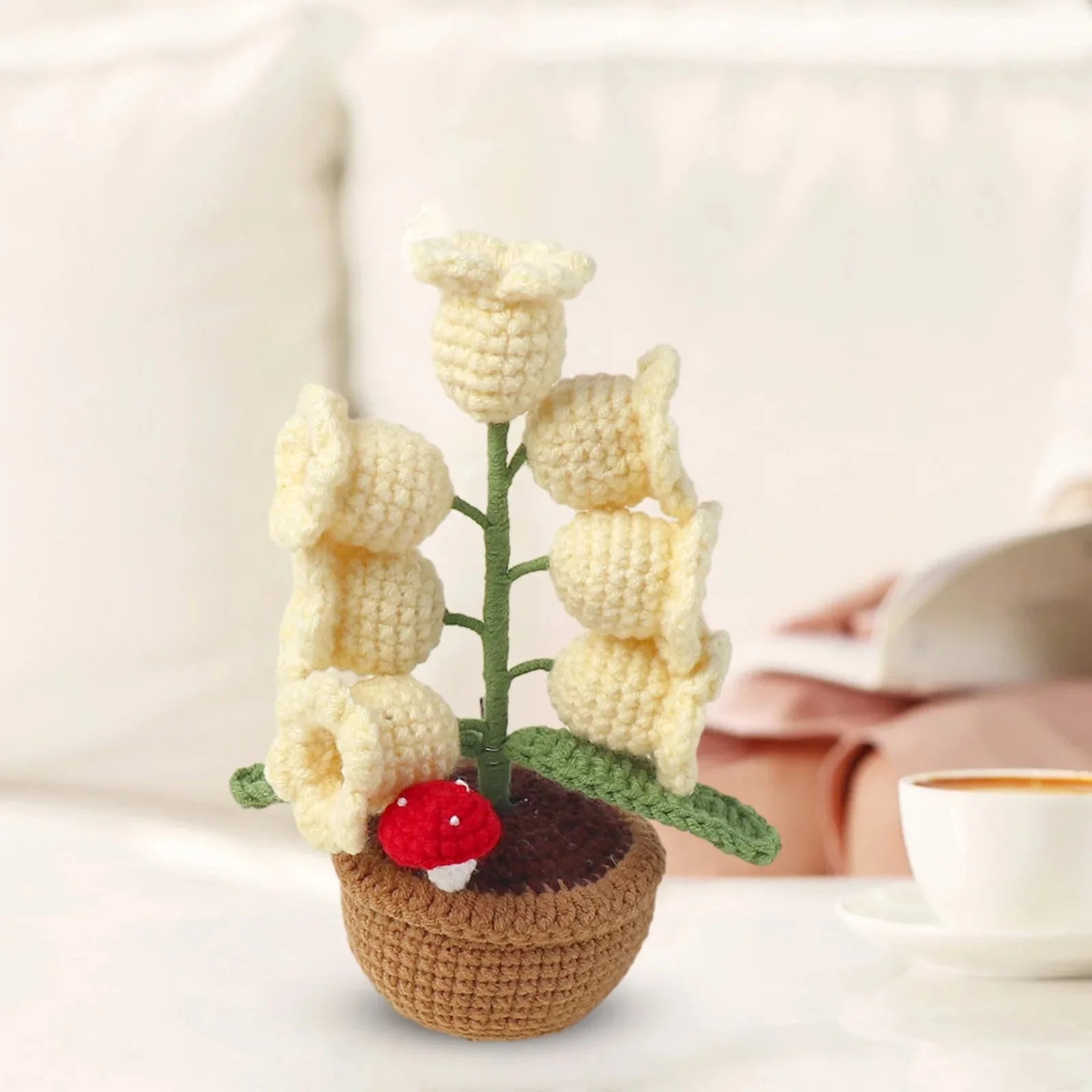 Knitted lily of the valley with LED light.