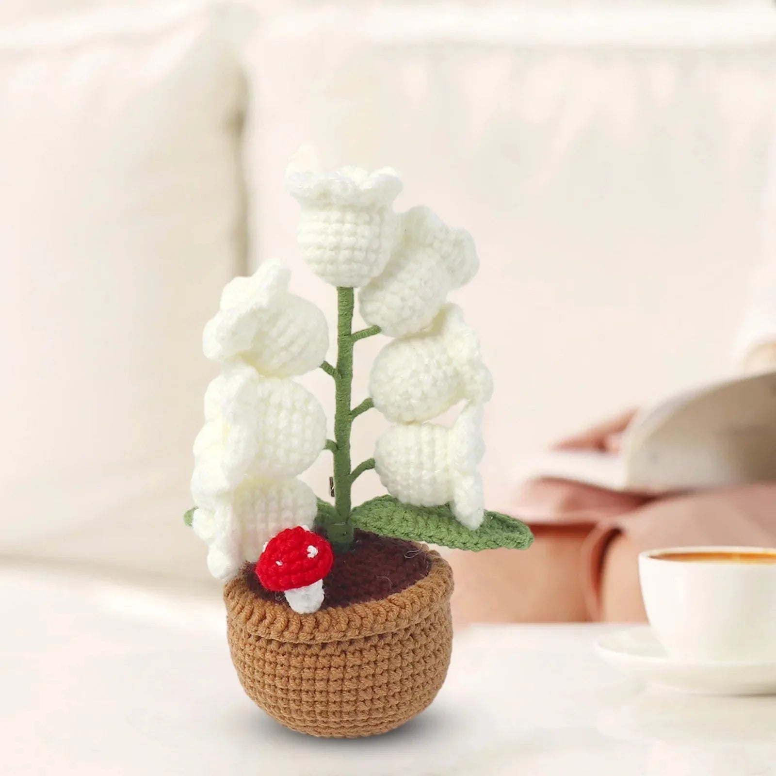 Knitted lily of the valley with LED light.