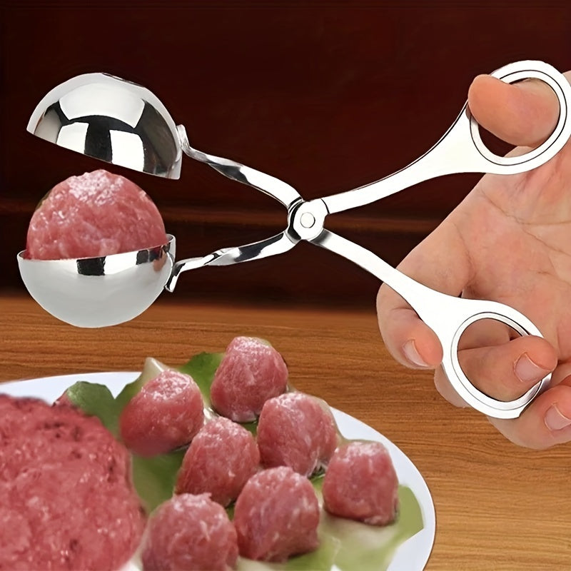 Stainless steel meatball press with non-slip handle.